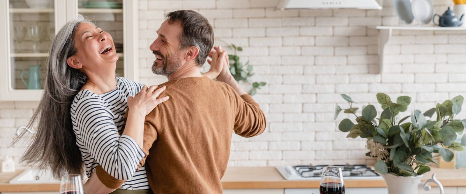 Couple dancing in a kitchen